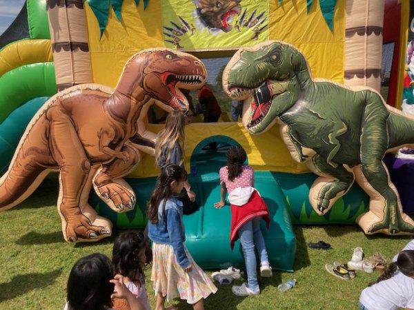 Kids having fun with dinosaurs on Easter at Lemoore Lions Park. 